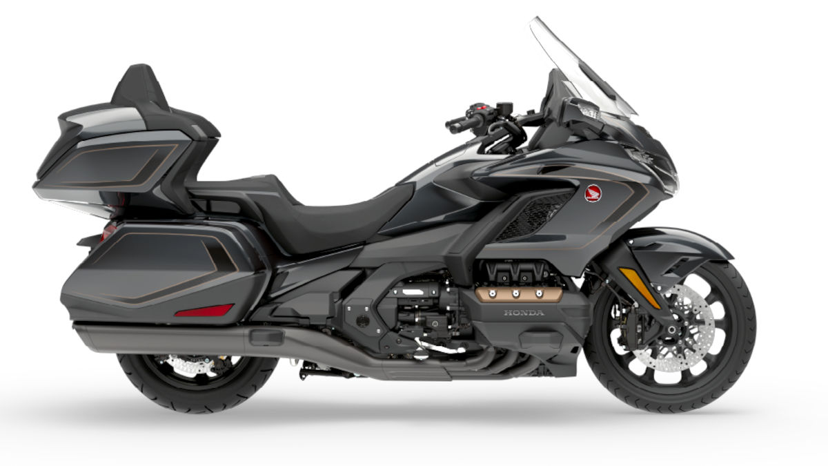 The 2026 Honda Gold Wing Tour hits India at Rs 44.30 Lakh! Dive into the massive 1,833cc flat-six engine, DCT gearbox, and luxury tech specs. Read more!